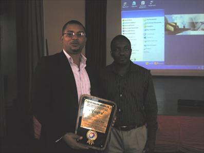 Yomatech Managing Director Chris Roberts with the Total EPNL Award for Excellence